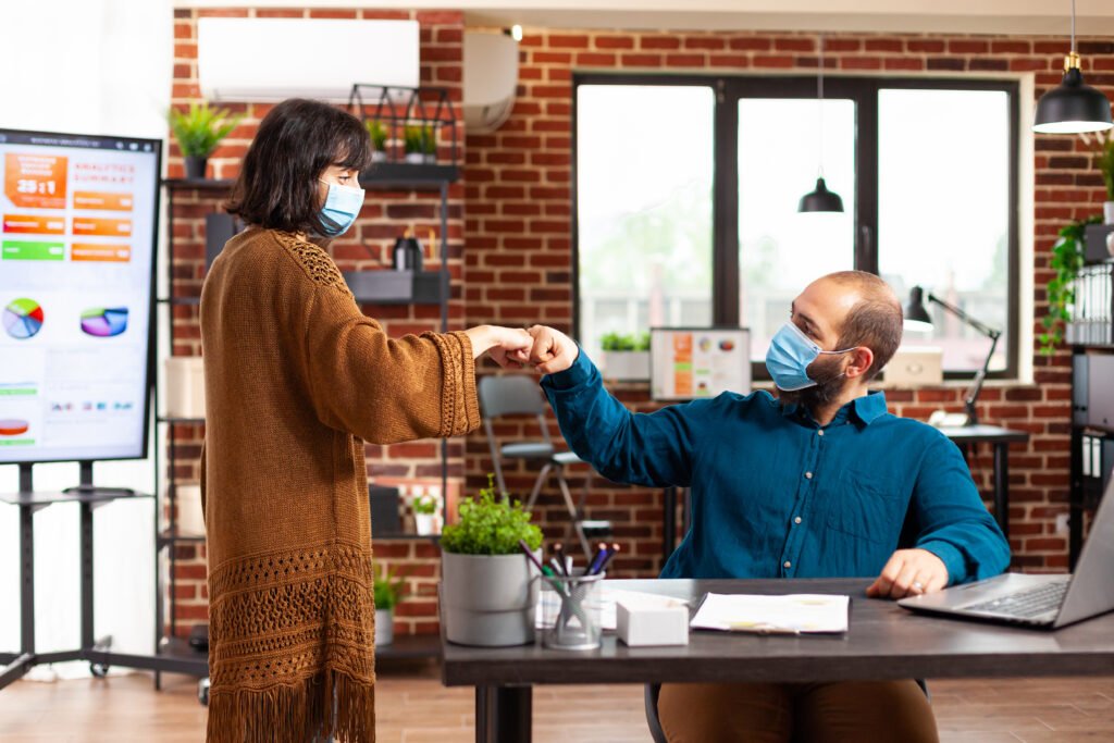 Business professionals discussing a transaction and working together on a business deal in an office